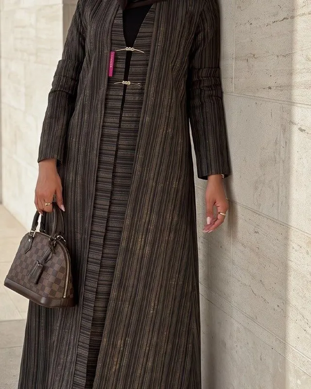 Front of the striped abaya showing the inner layer and bar clasps
